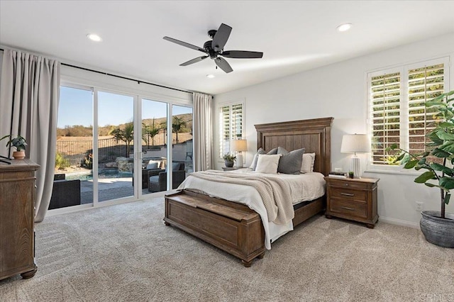 bedroom featuring ceiling fan, light colored carpet, and access to outside