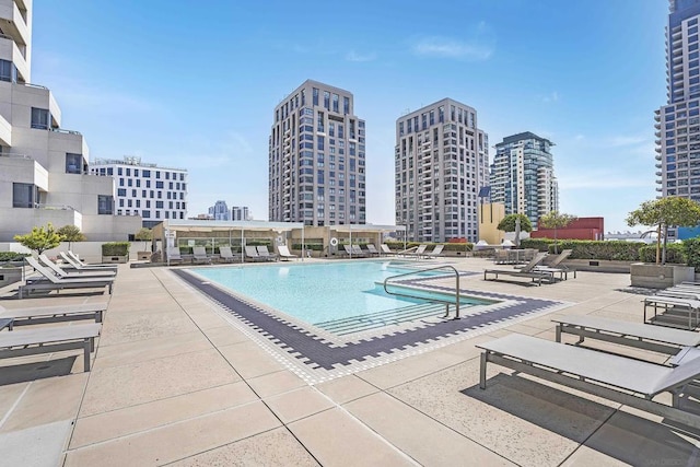 view of swimming pool with a patio