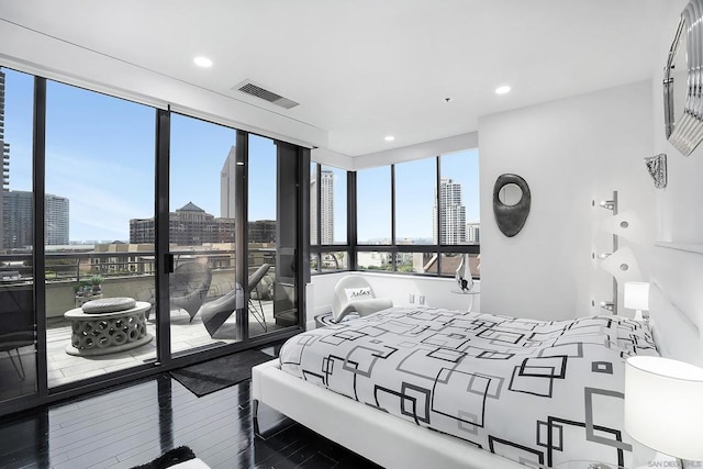 bedroom with hardwood / wood-style flooring