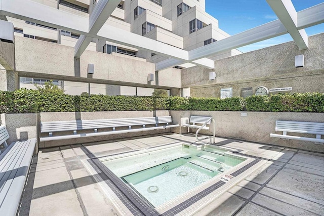 view of pool with a community hot tub