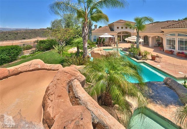 view of pool featuring a gazebo and a patio area