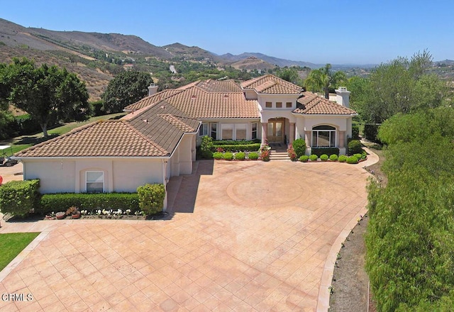 mediterranean / spanish house with a mountain view