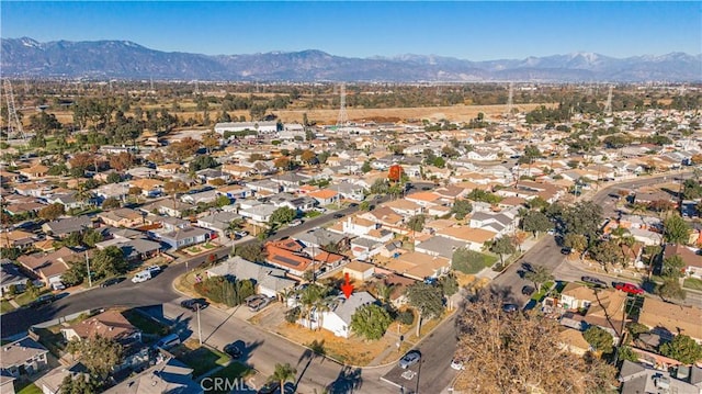 birds eye view of property with a mountain view