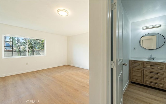 bathroom with hardwood / wood-style floors and vanity