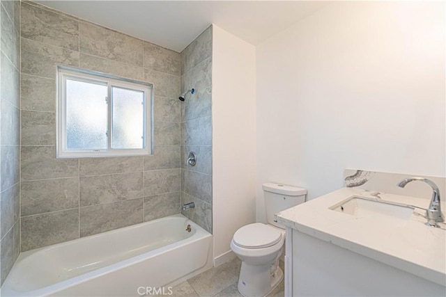 full bathroom with tile patterned floors, tiled shower / bath combo, vanity, and toilet