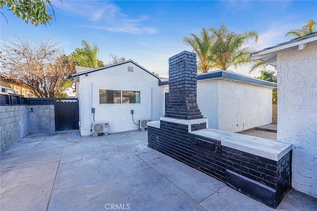 rear view of house featuring a patio