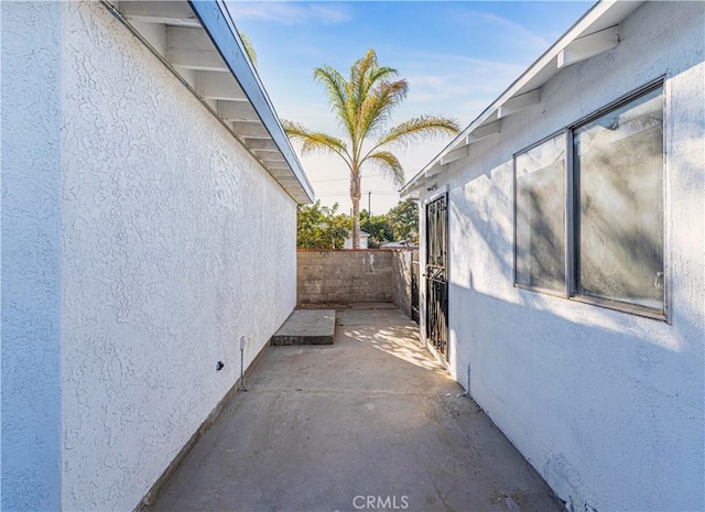 view of side of home featuring a patio