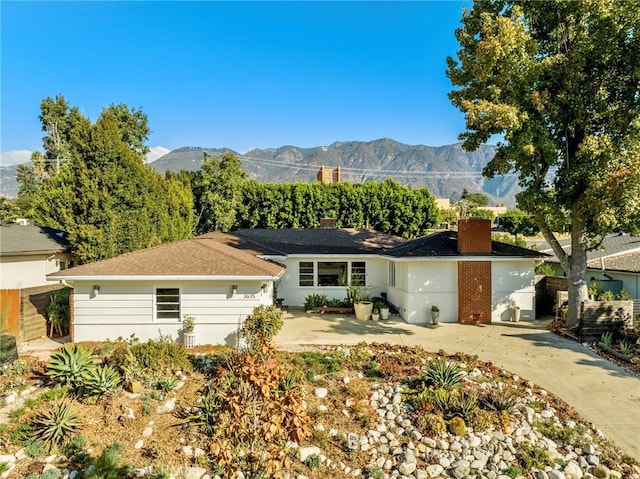 view of front of property with a mountain view