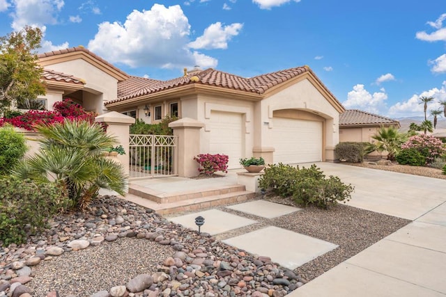 mediterranean / spanish-style house featuring a garage