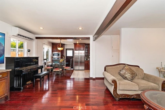 living room featuring dark hardwood / wood-style floors and a wall unit AC