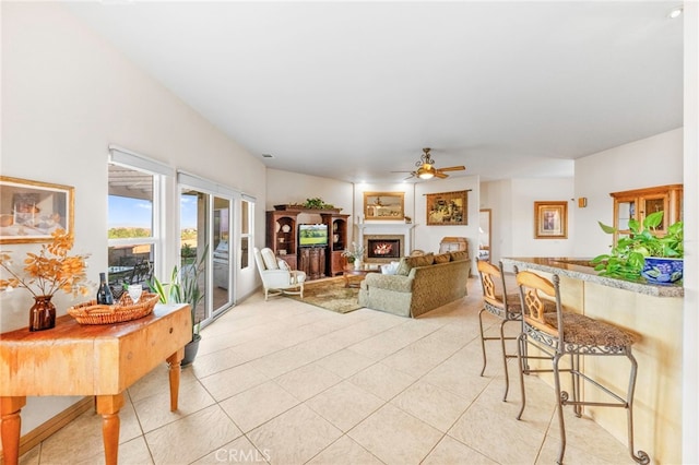 tiled living room featuring ceiling fan