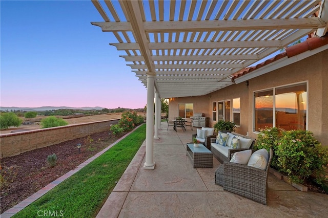 patio terrace at dusk with an outdoor living space and a pergola