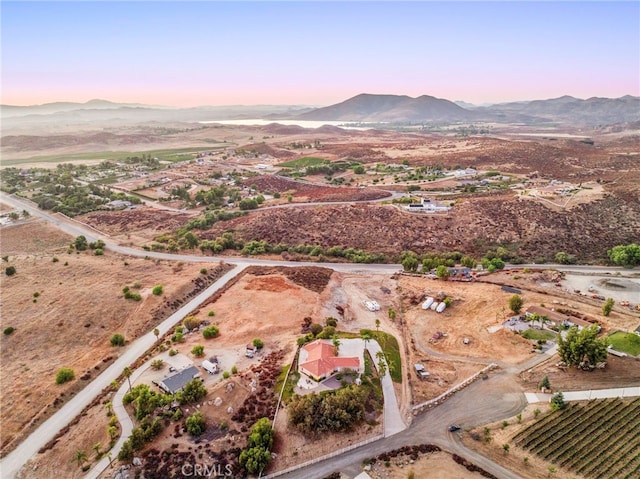 aerial view at dusk with a mountain view