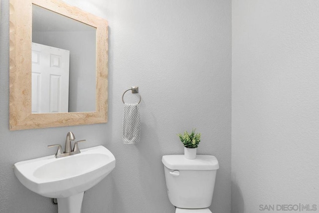 bathroom featuring sink and toilet