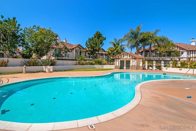 view of swimming pool with a patio area