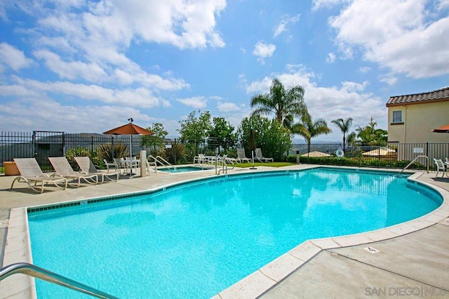 view of pool featuring a patio