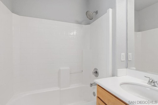 bathroom with vanity and bathtub / shower combination