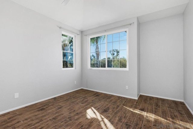 empty room with dark hardwood / wood-style floors