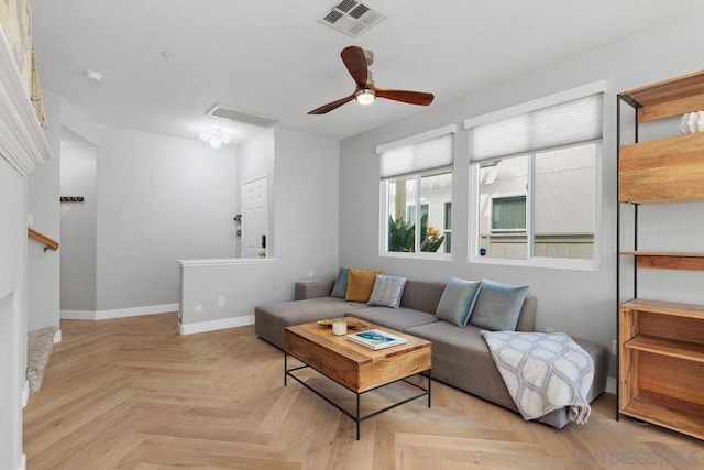 living room with ceiling fan and light parquet floors