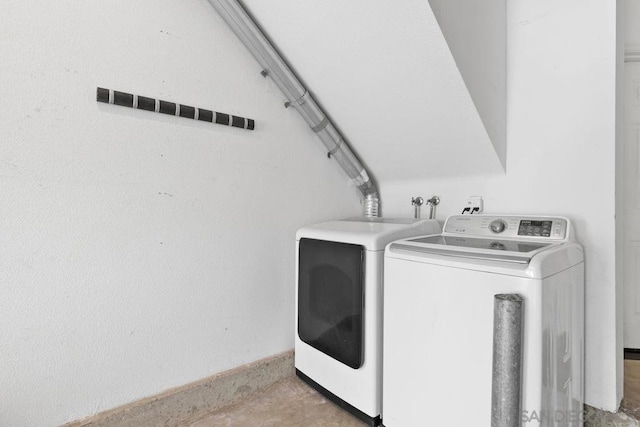 laundry area with washing machine and dryer