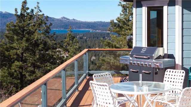 balcony with a mountain view and area for grilling