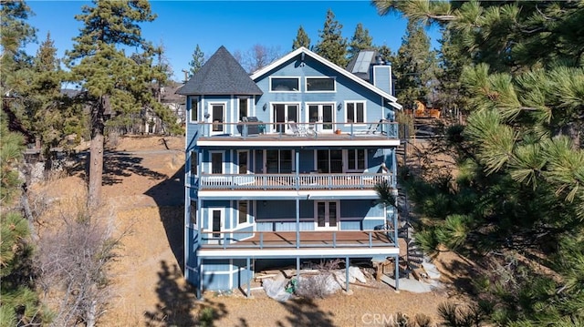 rear view of house featuring a balcony