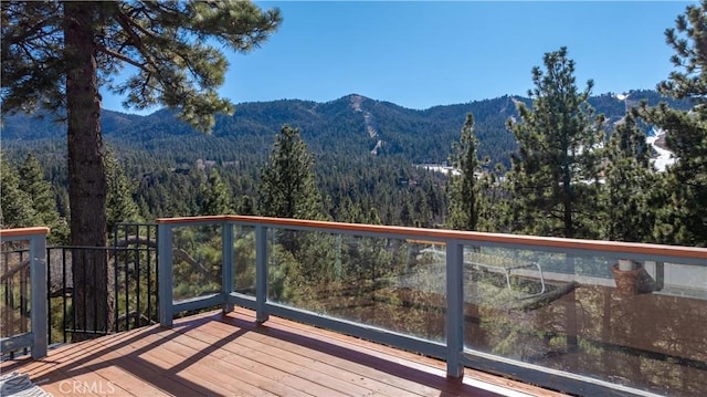 wooden terrace with a mountain view