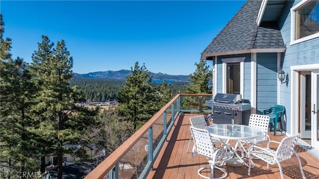 balcony featuring a mountain view and grilling area