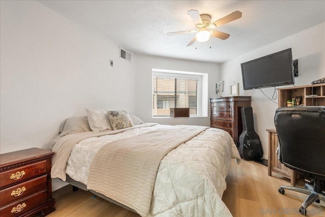 bedroom featuring ceiling fan and light hardwood / wood-style floors