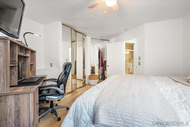 bedroom with ceiling fan and light hardwood / wood-style floors