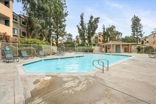 view of swimming pool with a patio