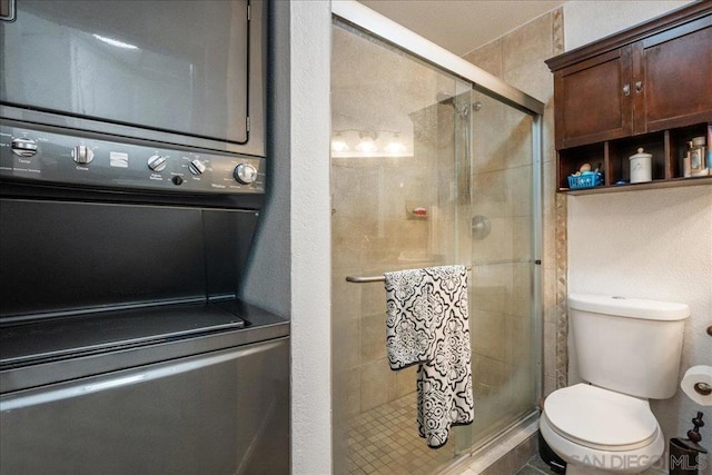 bathroom featuring an enclosed shower and toilet