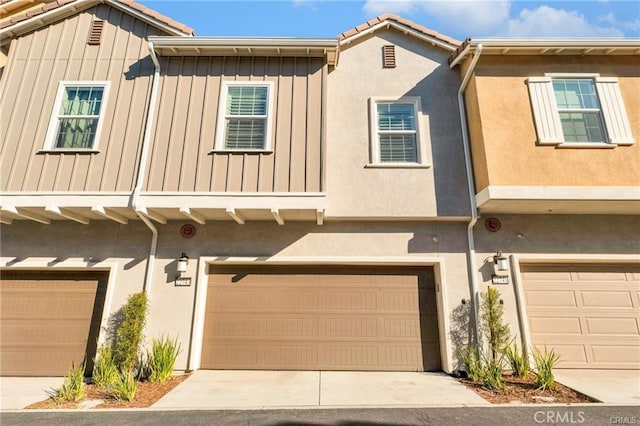 multi unit property featuring a garage