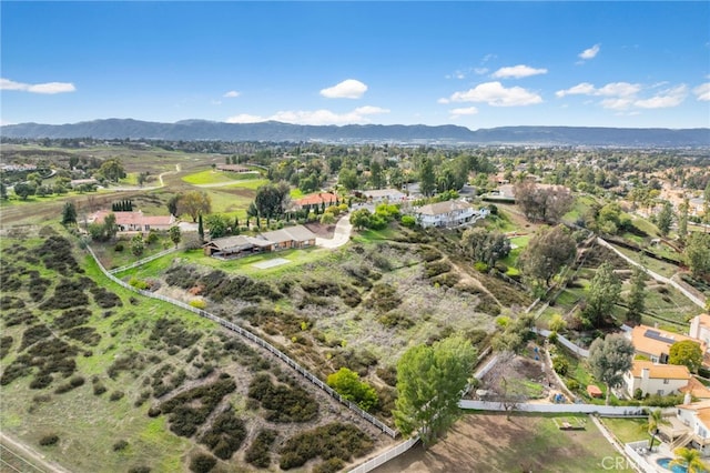 birds eye view of property featuring a mountain view