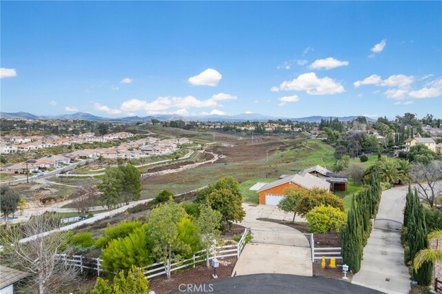 birds eye view of property with a mountain view