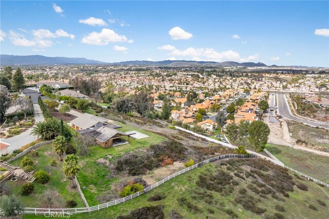 birds eye view of property featuring a mountain view