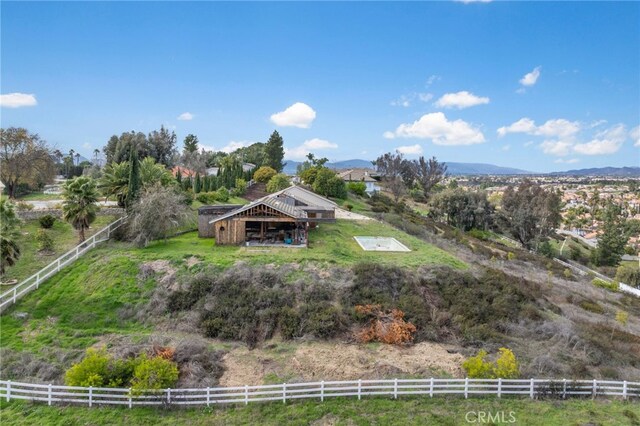 bird's eye view featuring a rural view and a mountain view