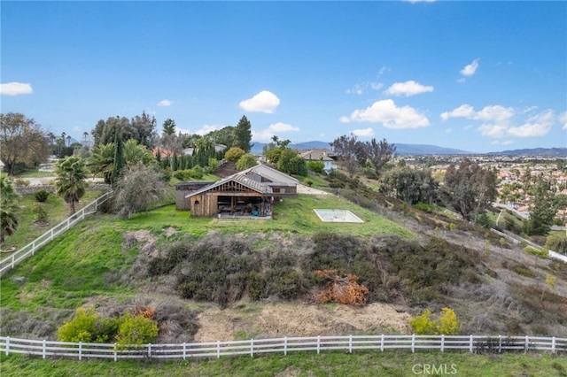 aerial view featuring a rural view and a mountain view