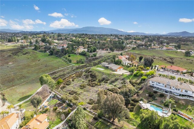 birds eye view of property with a mountain view