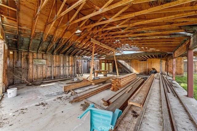 miscellaneous room featuring lofted ceiling