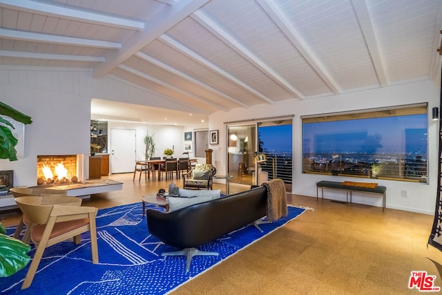 living room with lofted ceiling with beams