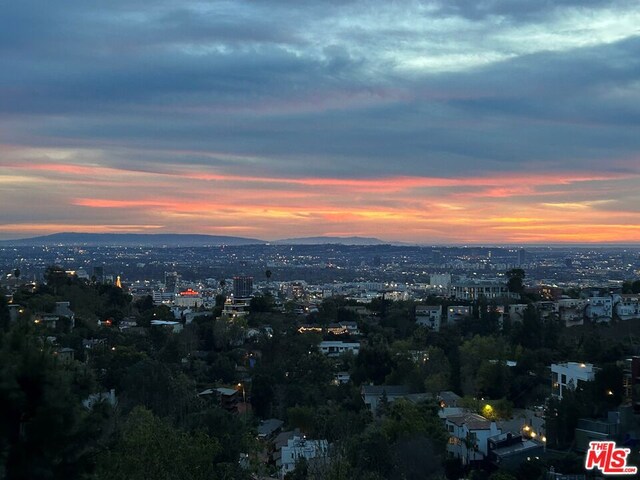 property's view of city with a mountain view