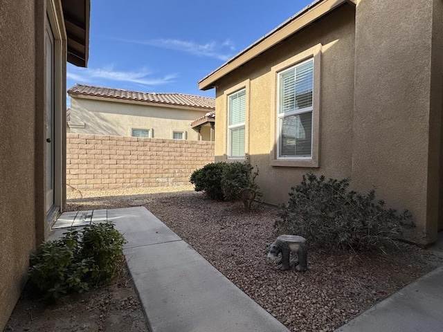 view of side of property featuring a patio