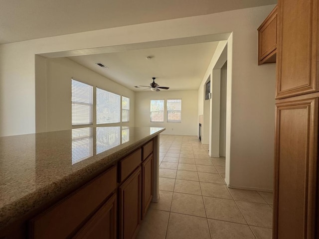 hall featuring light tile patterned flooring