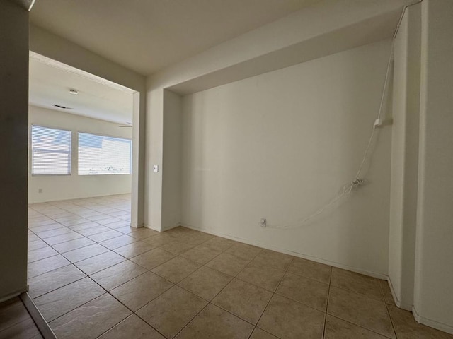 unfurnished room with light tile patterned floors