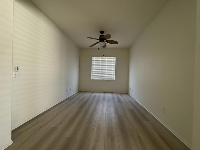 empty room featuring light hardwood / wood-style floors and ceiling fan