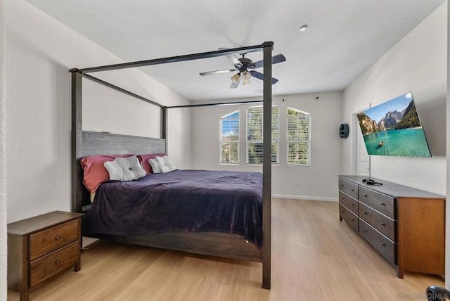 bedroom featuring ceiling fan and light hardwood / wood-style flooring