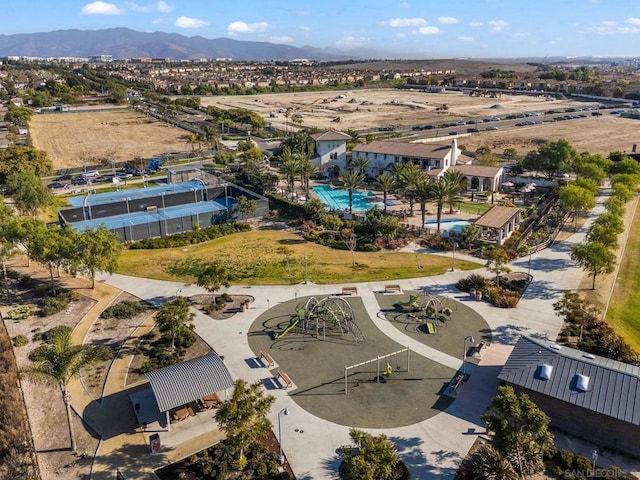 birds eye view of property featuring a mountain view