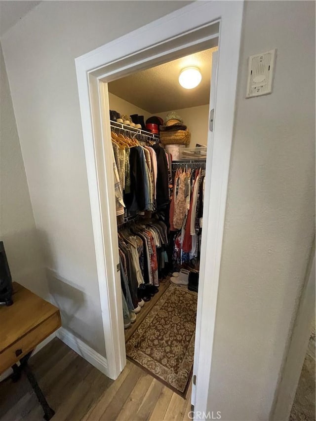 walk in closet featuring light wood-type flooring