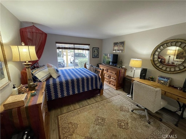 bedroom featuring wood-type flooring